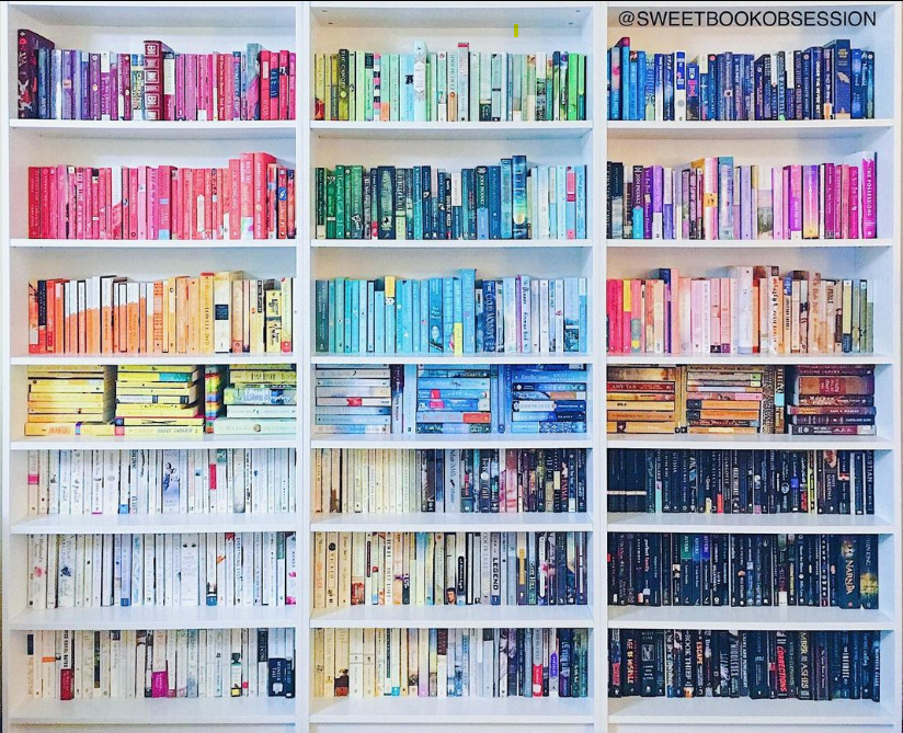 Books organized by color to create a rainbow effect. Home Library Organization. Book Organization